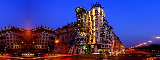 Trip Ayurveda Reisetipps - Das tanzende Haus ist ein Bürogebäudes in der tschechischen Hauptstadt Prag. Beliebte Aussichtsplattform mit schöner Architektur in Prag. Das „Tanzende Haus“ in Prag, das charismatische Bürogebäude mit dem Namen Ginger & Fred in Tschechien bezaubert mit mutiger Architektur. Geschwungen, dynamisch, strahlt es eine charmante Ungezwungenheit und Fröhlichkeit aus. Oben in der Glas-Bar genießt man den herrlichen Rundblick. Wie eine Tänzerin im Kleid, die sich an einen Herrn mit Hut schmiegt: Und doch ist es ein Haus. Das Tanzhaus ist eines der neuen Denkmäler der Stadt.